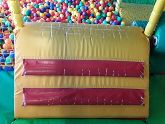 worn ball pit entry ramp in childrens play area