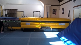 Yellow Airpit landing mat with side walls