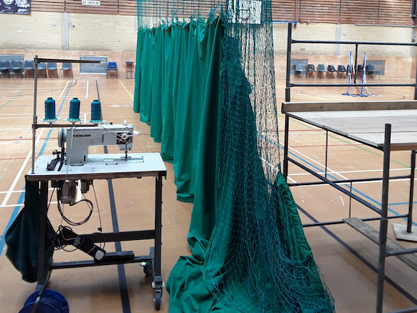 MDS Leisure stitching repairs to a sports arena net curtain
