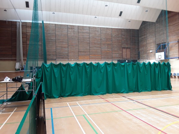 Fitted repaired sports hall net curtain